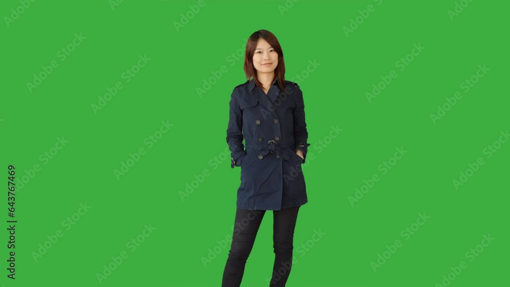 Lifestyle Portrait of Chinese Female Person against Green Background Lifestyle Portrait of Chinese Female Person against Green Background