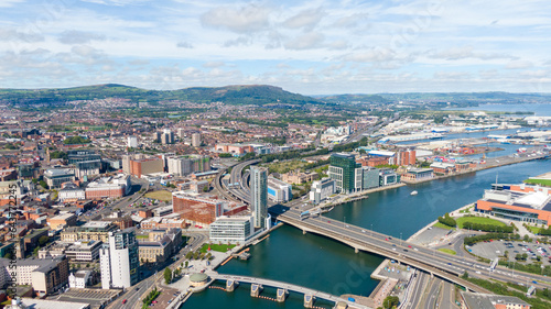 Aerial view on buildings and Lagan River in City center of Belfast Northern Ireland. Drone photo  high angle view of town