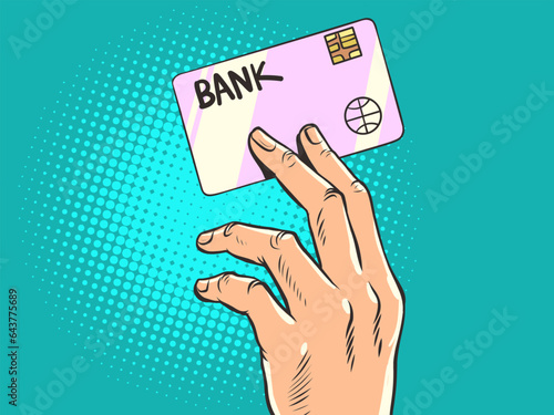 The human hand holds a bank card. Credit and debit plastic card. Electronic money. Payment for goods and services online. Purchasing an application using a transfer. Pop Art Retro