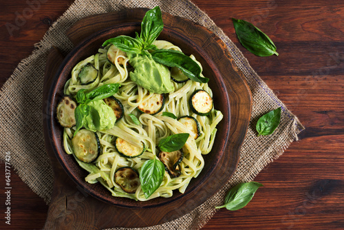 Bright and delicious vegetarian pasta with zucchini in avocado sauce