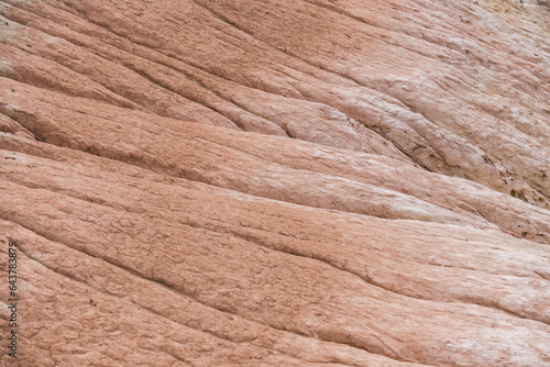 Traces in the slopes of multi-colored limestone hills from rivers and streams, relief in the chalk hills in the steppe photo