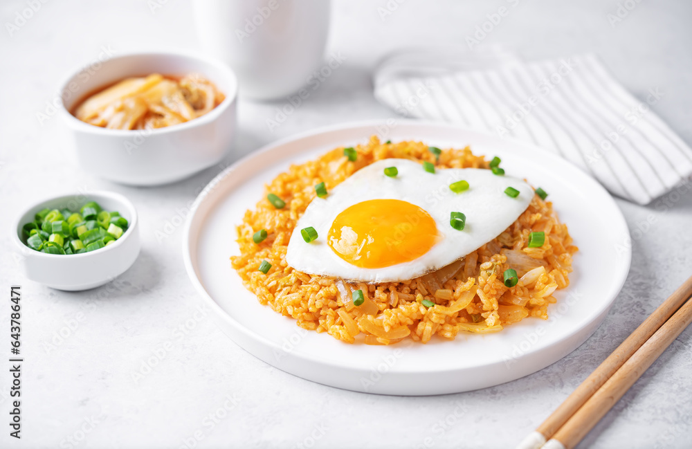Kimchi fried rice with fried egg and scallion sprinkle Kimchi fried rice with fried egg and scallion sprinkle