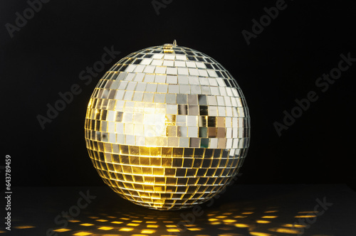 Disco ball with flashing lights on a black background