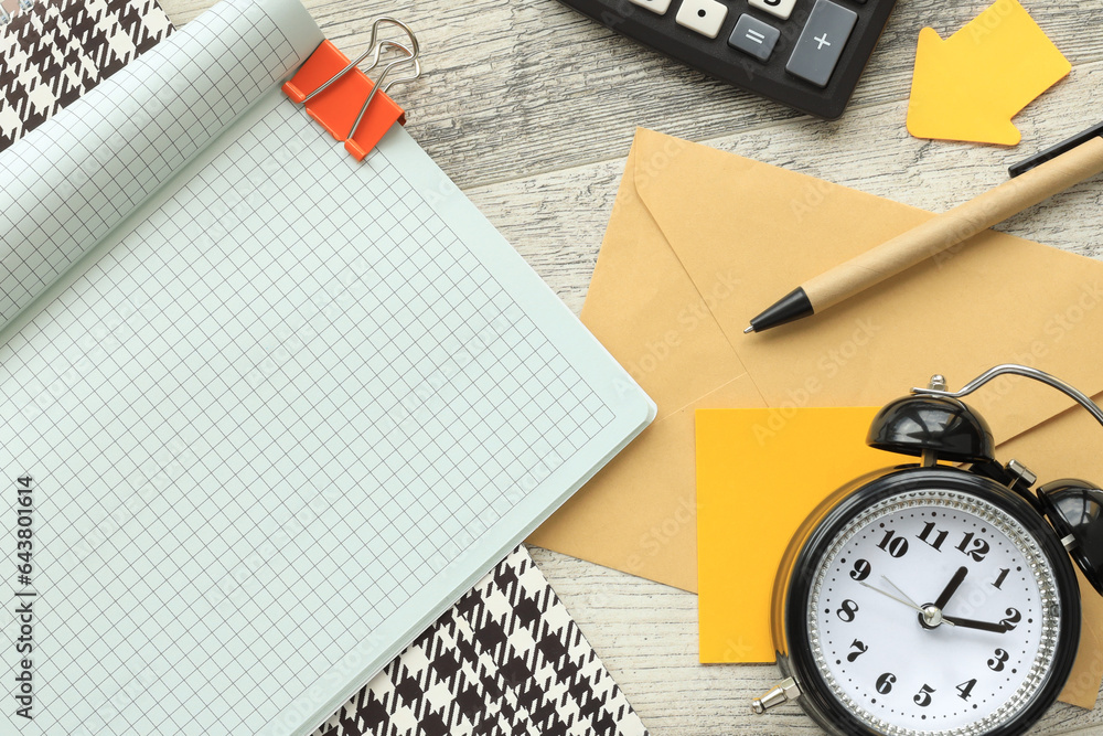 top view of notebook page corner.desk clock.copy space, flat lay. Business and finance concept. top view of notebook page corner.desk clock.copy space, flat lay. Business and finance concept.