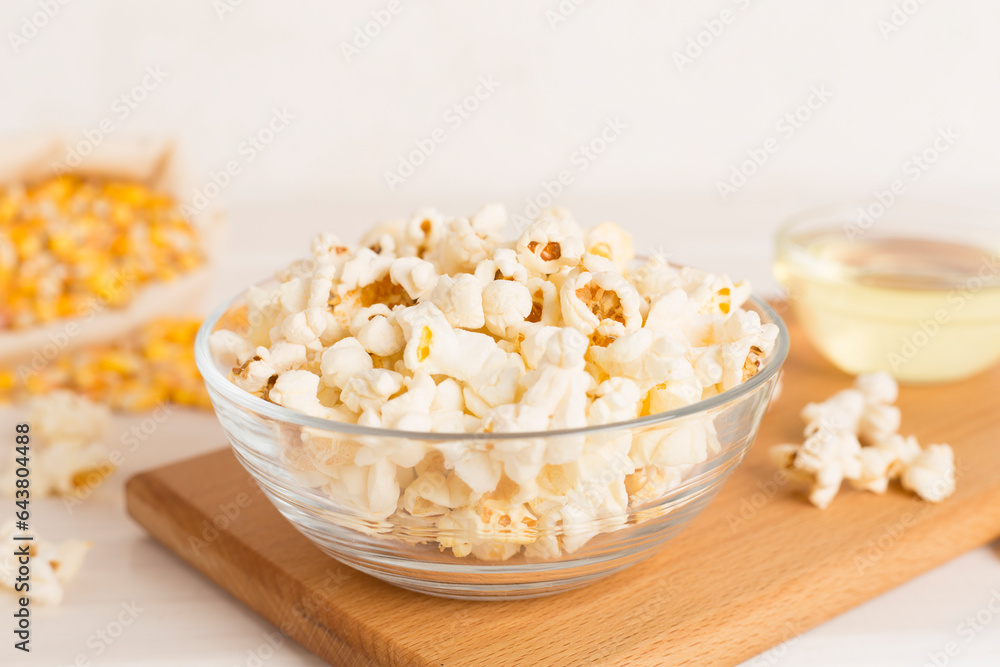 Prepared popcorn with ingredients on wooden table Prepared popcorn with ingredients on wooden table