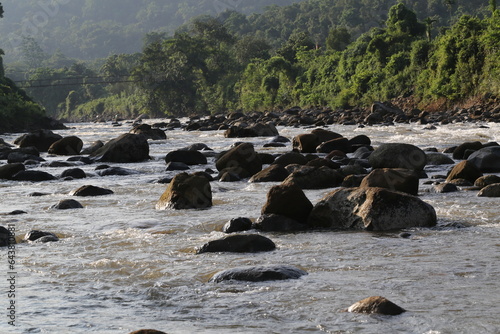 Water flows through mountain river 