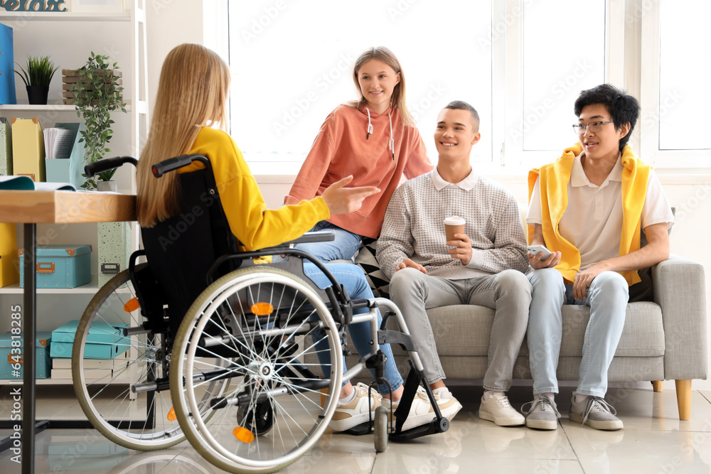 Group of teenage students with girl in wheelchair at school Group of teenage students with girl in wheelchair at school