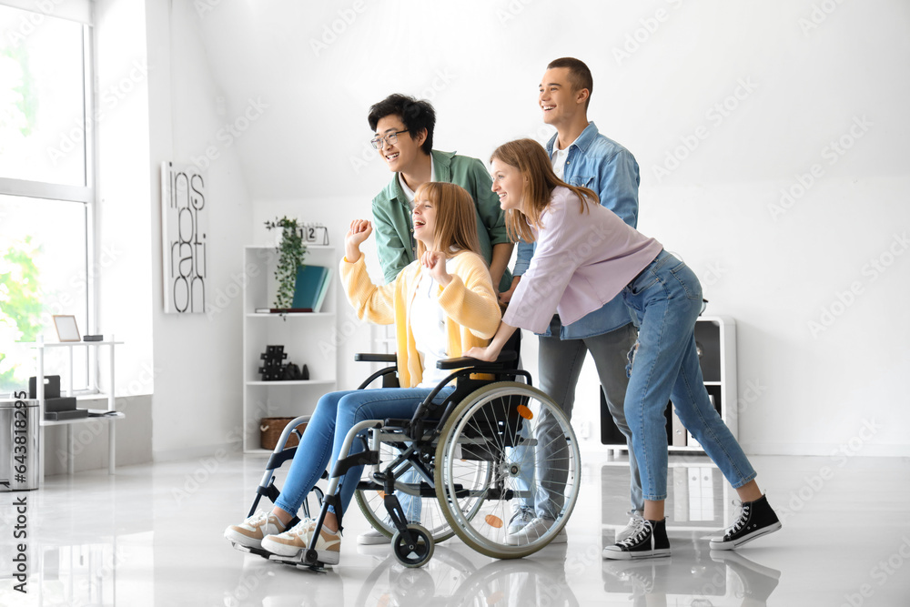 Group of teenage students with girl in wheelchair at school Group of teenage students with girl in wheelchair at school