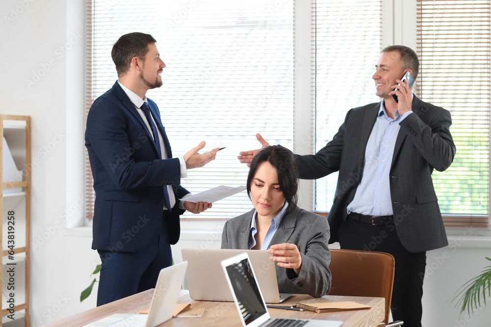 Business consultants working in office Business consultants working in office