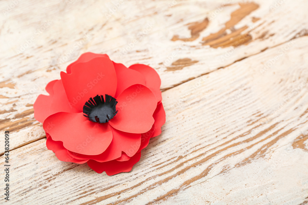 Red poppy flower on light wooden background. Remembrance Day in Canada Red poppy flower on light wooden background. Remembrance Day in Canada