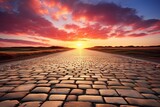 Road in the sunset, evening light, a flat, large cobble stone road stunning sky at sunset with clouds