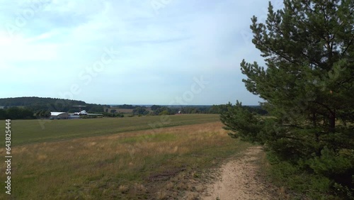 Lovely aerial view flight drone. II-62 aircraft on ground. hilly summer fields photo