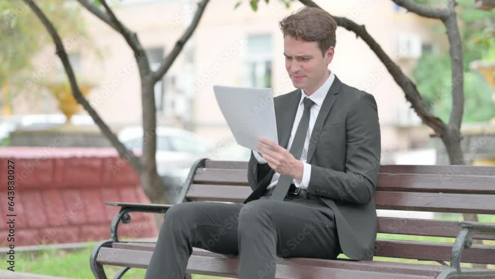 Businessman with Loss Reading Contract Outdoor Businessman with Loss Reading Contract Outdoor