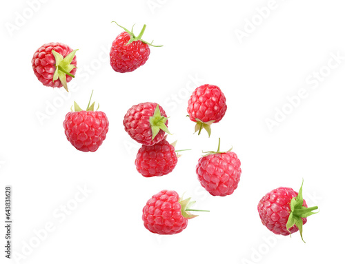 Many fresh ripe raspberries falling on white background