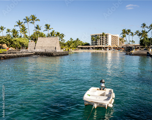 Small Boat On Kailua Bay With Kamakahonu National Historic Landmark in The Background, Kailua-Kona, Hawaii, Island, Hawaii, USA photo