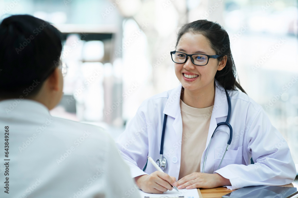 Doctor talking to a patient at medical clinic.. Doctor talking to a patient at medical clinic..
