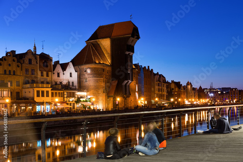 View on illumination of night embankment of Moltawa River in Gdansk in the Poland. photo