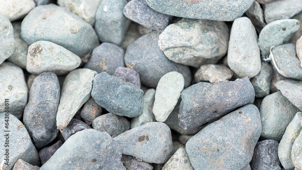 Grey small stone texture background on the beach.