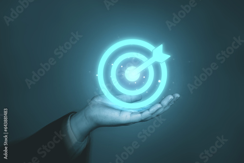 Businessman's holding a target board virtual. concept of target and teamwork to achieve goals.