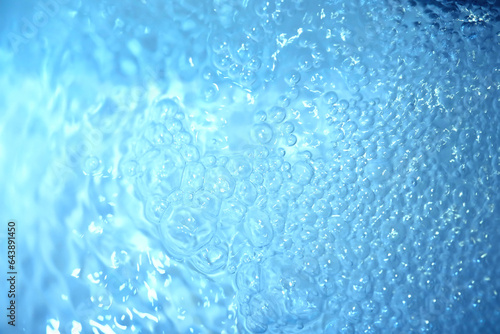 Blue water texture. Bubbles and bubbling water. © alexkich
