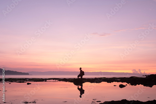 beautiful beach with coral reefs dotted with greenery © Cavan