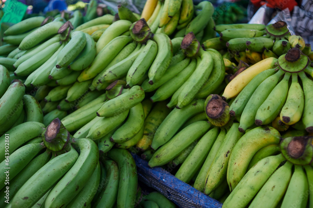 Heap of  raw bananas at market stall