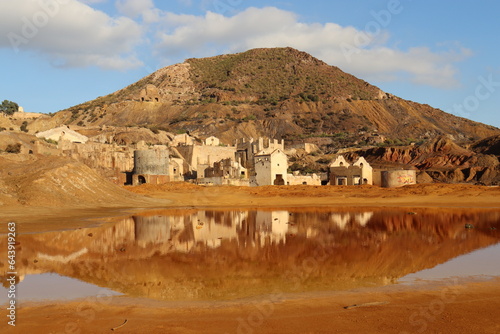 Abandoned mines of Mazarron in Southern Spain, post-apocalyptic landscape with ruins and red puddles photo