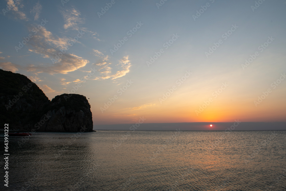 Fishermen's Cove. Seaside rocks and long exposure. Sunset on the beach. Sunset by the sea. Galippoli, Canakkale Türkiye.