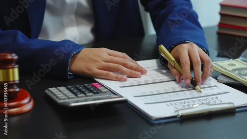 Legal consultant and real estate attorney lawyer read the building lease contract signing agreement for local business.