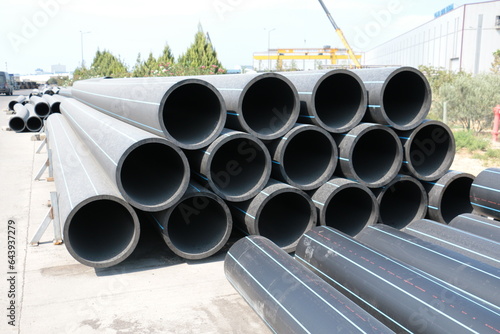 PE pipe plant, Industrial PE pipes with blue line for gas and water. HDPE pipe, Polyethylene PE100 pipe. Polyethylene pipe plant © Elshad Aliyev