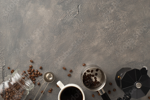 Sip & Celebrate: Top-down photo showcasing scattered coffee beans, espresso cup, coffee turk, barista's spoon, and kettle on grunge grey canvas, ideal for your advert