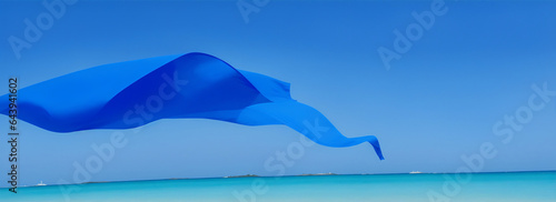 Blue fabric floating in the wind at beach background from Generative AI