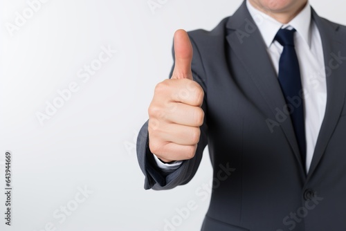 Thumbs up from a Business professional isolated on white background