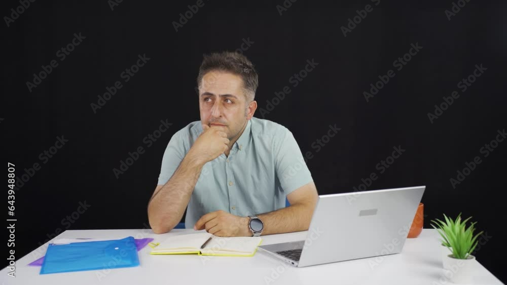 Man looking at laptop is thoughtful. Man looking at laptop is thoughtful.