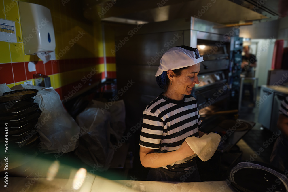 Young Woman Working Pizza Dough at Pizzeria Young Woman Working Pizza Dough at Pizzeria