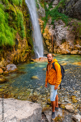 Hiker at Grunas waterfall in Theth national park  Albania. Albanian alps
