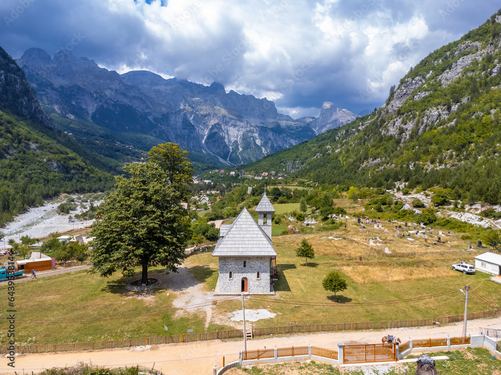 Aerial view over the Catholic Church in the valley of Theth National Park, Albania. albanian alps
