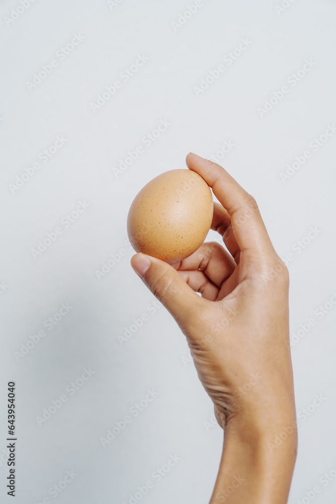 Close-up of woman hands tenderly holding free-range chicken eggs, quality assessment and natural food production, organic agriculture and sustainable living, healthy food choices and farming Close-up of woman hands tenderly holding free-range chicken eggs, quality assessment and natural food production, organic agriculture and sustainable living, healthy food choices and farming