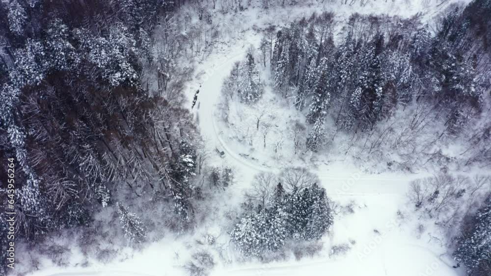 Drone Aerial view of Driving car with snow tires on local road in the ...