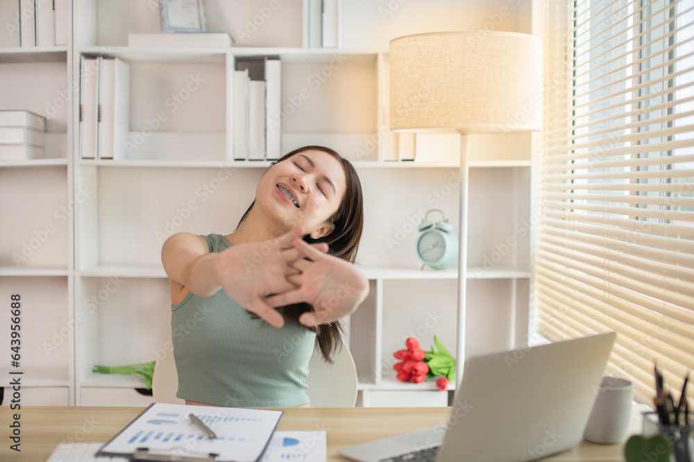 Young woman Relaxing After Work, Relaxed Young woman Unwinds, Stretch oneself. Young woman Relaxing After Work, Relaxed Young woman Unwinds, Stretch oneself.