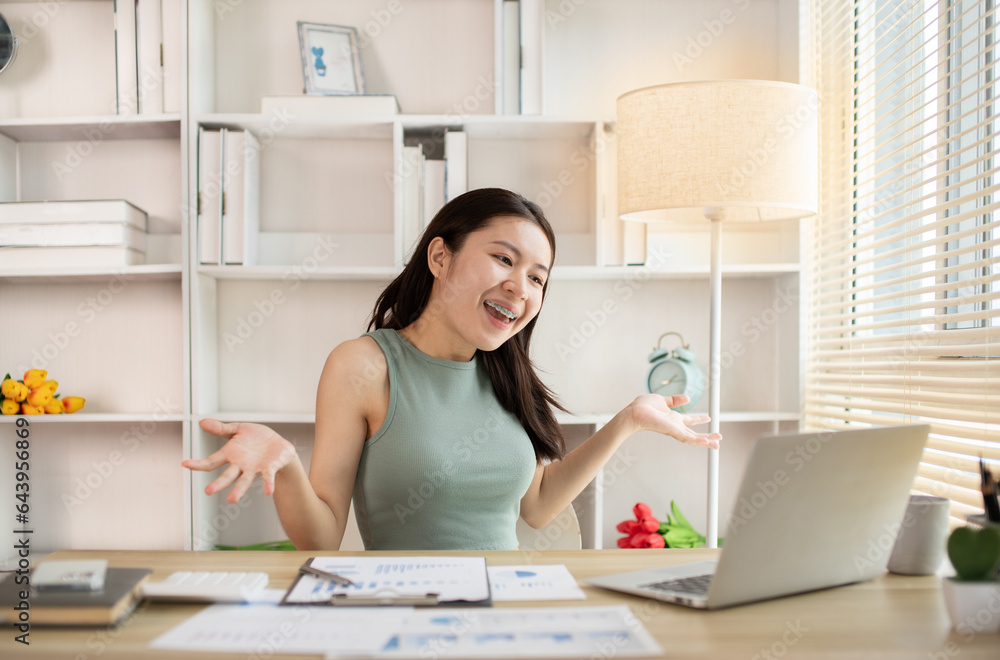 Young woman Working from Home, Video Call with Customer in Office, Remote Business Communication, Telecommuting Professional, Virtual Video Call with Office Customer, Work from Home Concept. Young woman Working from Home, Video Call with Customer in Office, Remote Business Communication, Telecommuting Professional, Virtual Video Call with Office Customer, Work from Home Concept.