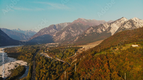 Italian mountain landscape in autumun with beautiful leafs colors and a river. Made by dji mavic mini 3 pro