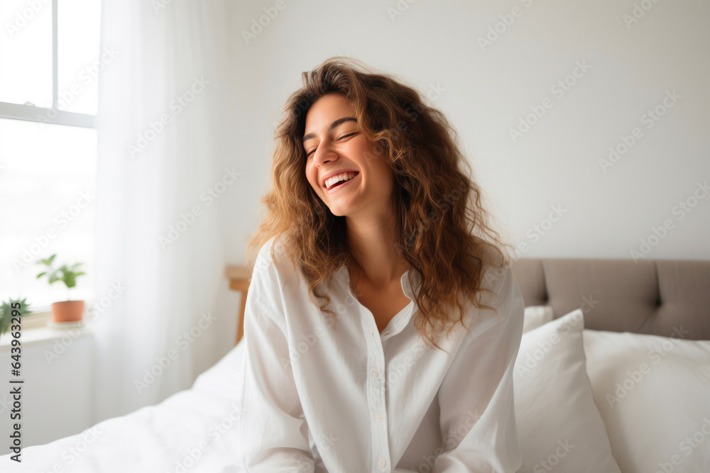 Young Woman Relaxing with Her Smartphone in Bed Young Woman Relaxing with Her Smartphone in Bed