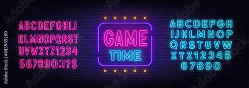 Game Time neon sign on brick wall background.