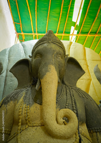 Artists Making Ganesh Idols, close up of Ganesha Idol at an artist's workshop during Ganesha Festival, eco friendly Clay Lord Ganesh Idols, Ganesh Making 2023 stock image, Crafts and Arts of India.  © om