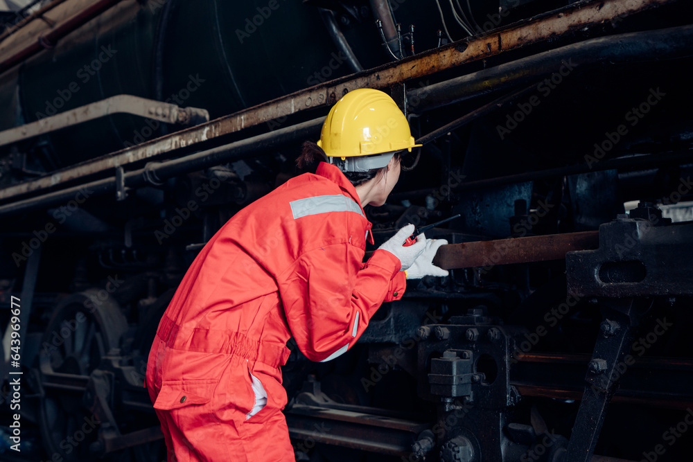 Engineer railway wearing safety uniform and helmet under checking under train ,wheels and control system for safety travel passenger. Banner cover design. Engineer railway wearing safety uniform and helmet under checking under train ,wheels and control system for safety travel passenger. Banner cover design.