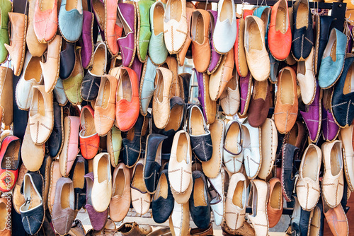 Traditional turkish leather shoes named yemeni. Colorful handmade leather slipper shoes displayed on the street market in Selcuk, Turkey.