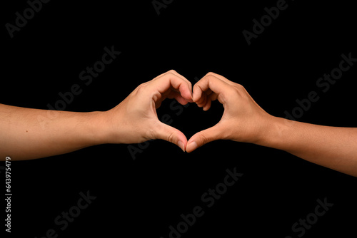 Couple making a heart shape with their hands symbol of love, Valentine's day, health insurance, charity and appreciation concept