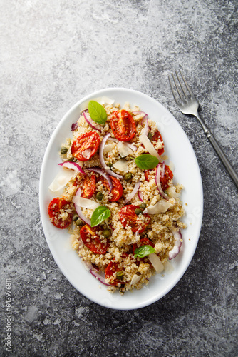 Warm couscous salad with tomatoes and red onion