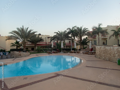 Beautiful view of the Egyptian hotel with palm trees  flowers and a swimming pool